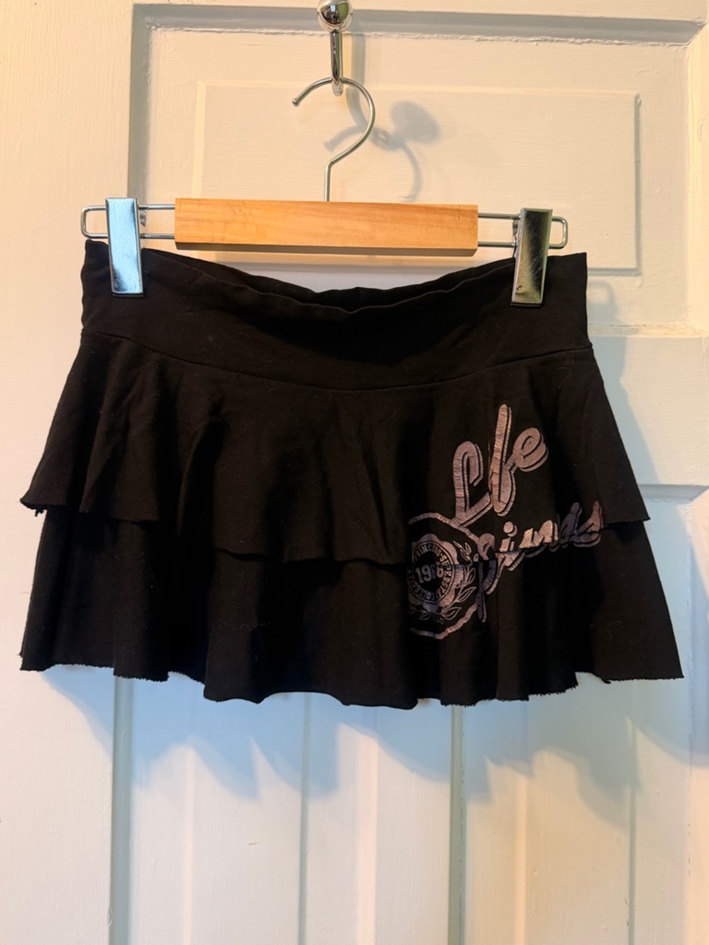 Black Tiered Mini Skirt with Graphic Accent